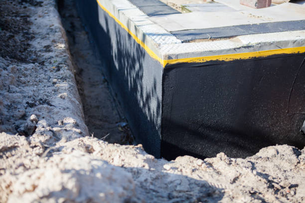 Professional Basement Waterproofing technician working in Highland, MD
